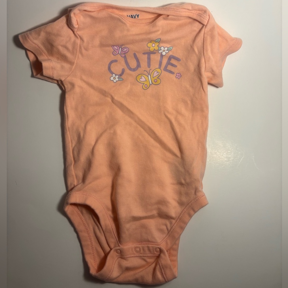 Old Navy Peach Short-Sleeve Baby One-Piece with "CUTIE" Graphic